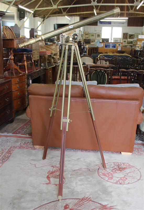 Modern brass telescope, on brass tripod stand